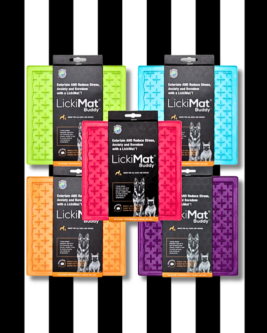 Collection of LickiMat buddy licky mats on a black and white striped background
